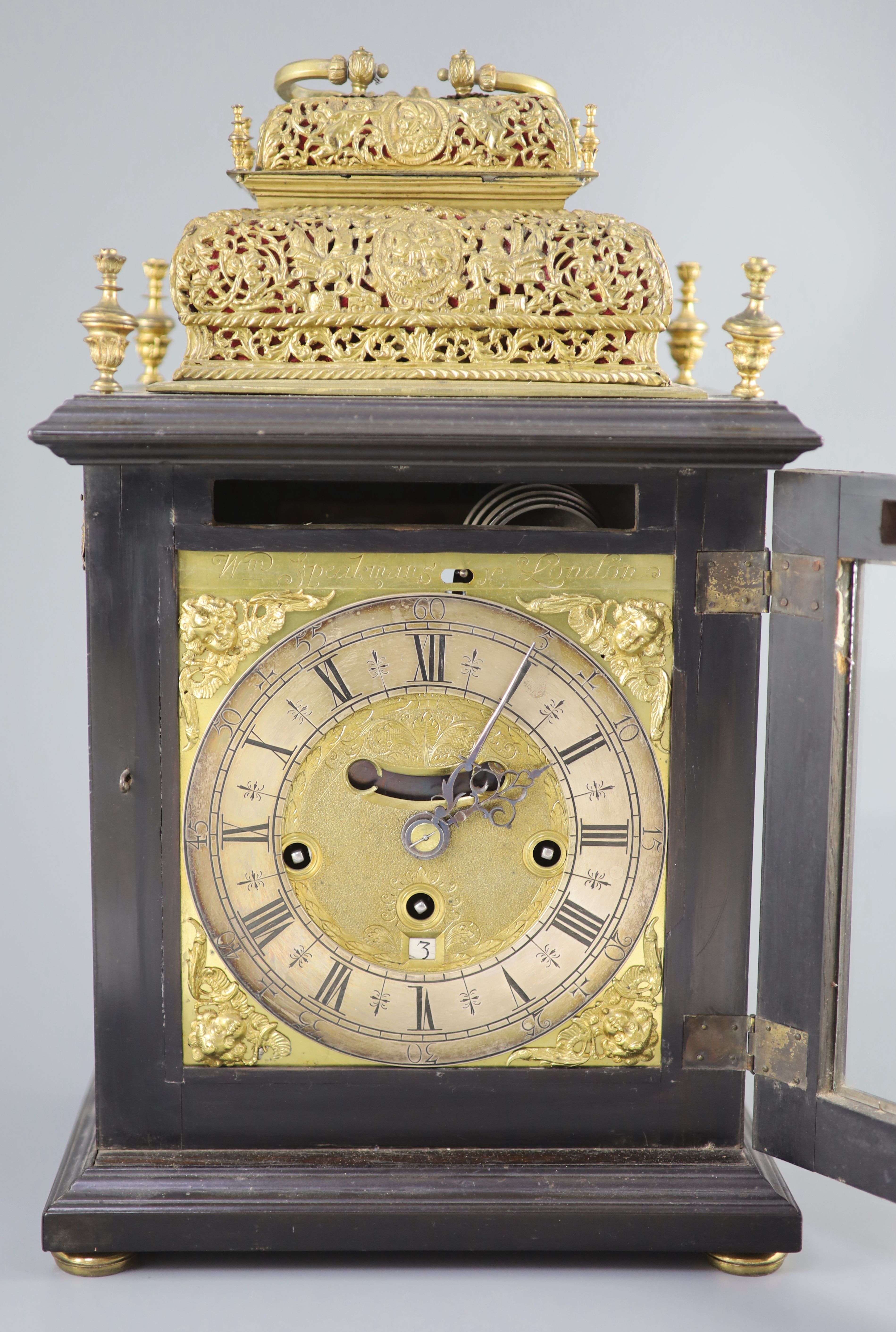 A William III ebonised cased and gilt metal double basket topped chiming and quarter repeating table clock, height 17in.